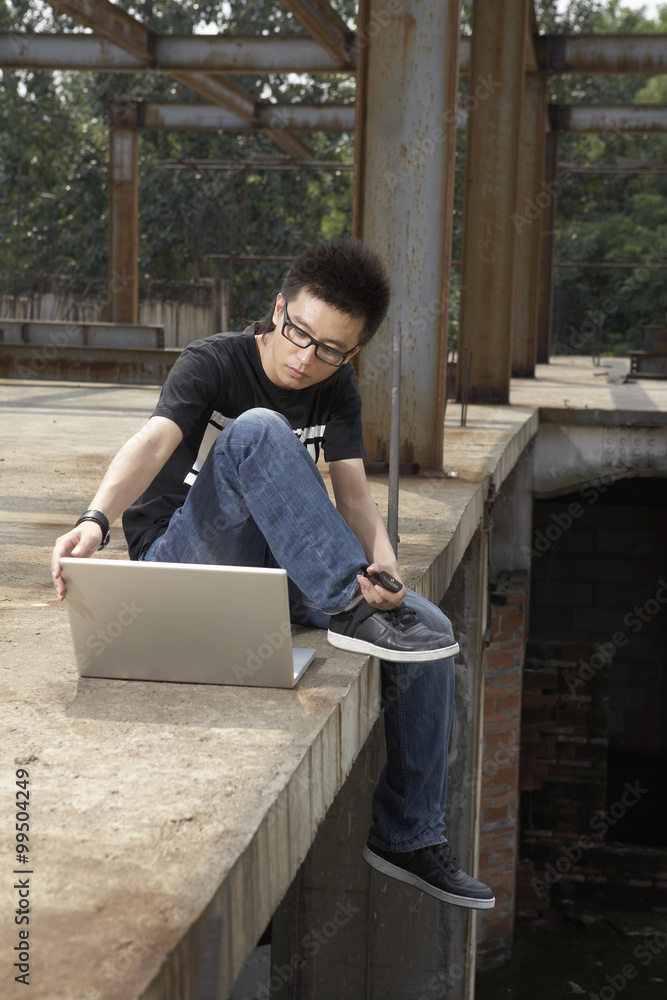 Man Looking At Laptop Computer