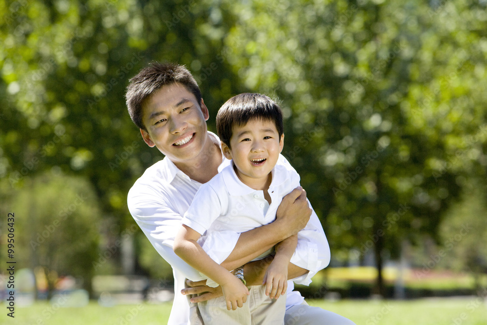 Father and son playing in the park