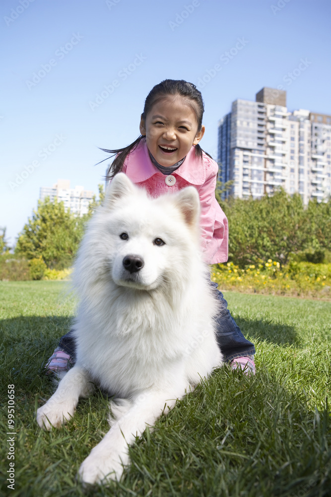 A young girl and her dog