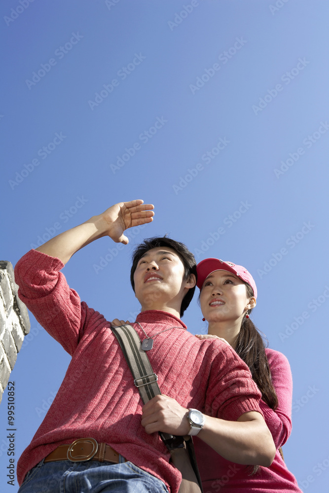 Young Couple Visiting The Great Wall Of China