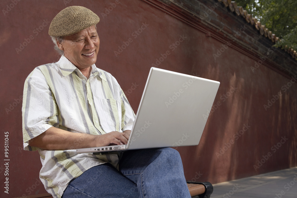 Man Typing On Laptop Computer