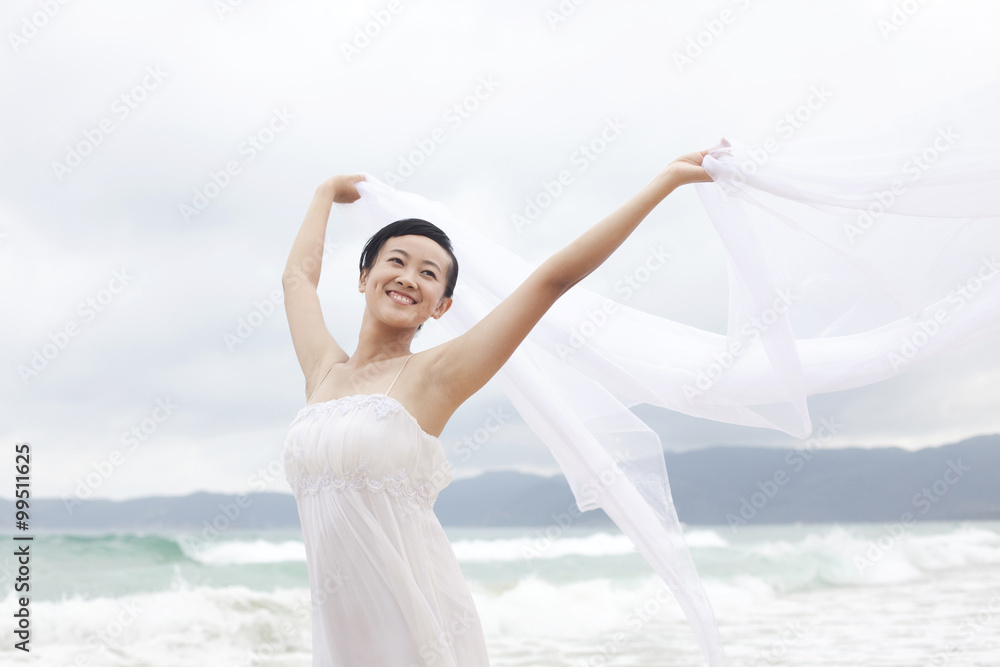 Portrait of young woman at the beach