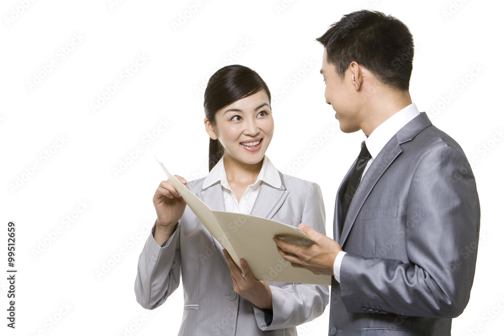 Businessmen looking through papers