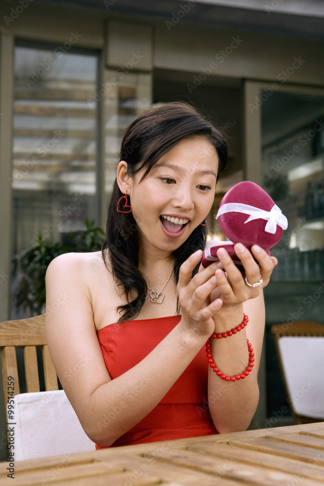 Young Woman Happy At Receiving Necklace