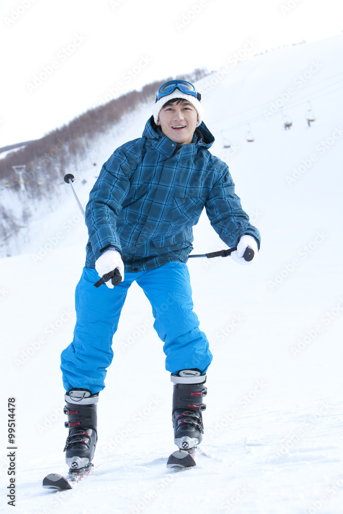 Young man in skiing resort