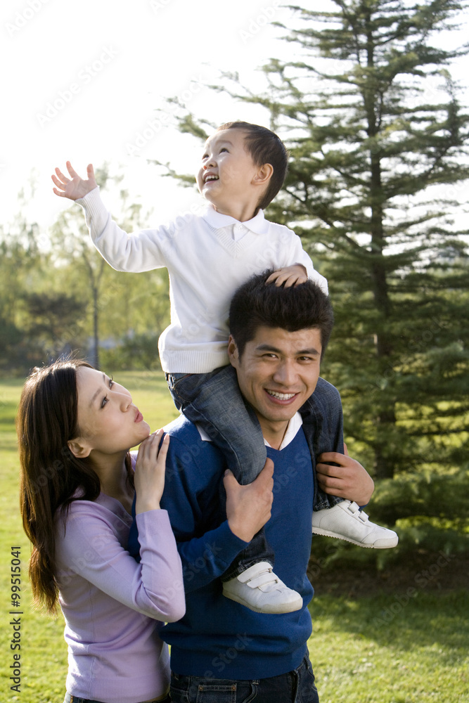 Portrait of young family at the park