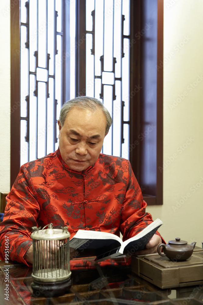 Elderly Man Reading Book