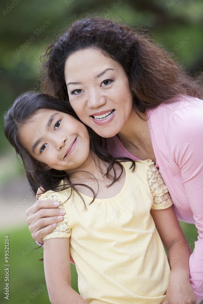 Cheerful mother and young daughter