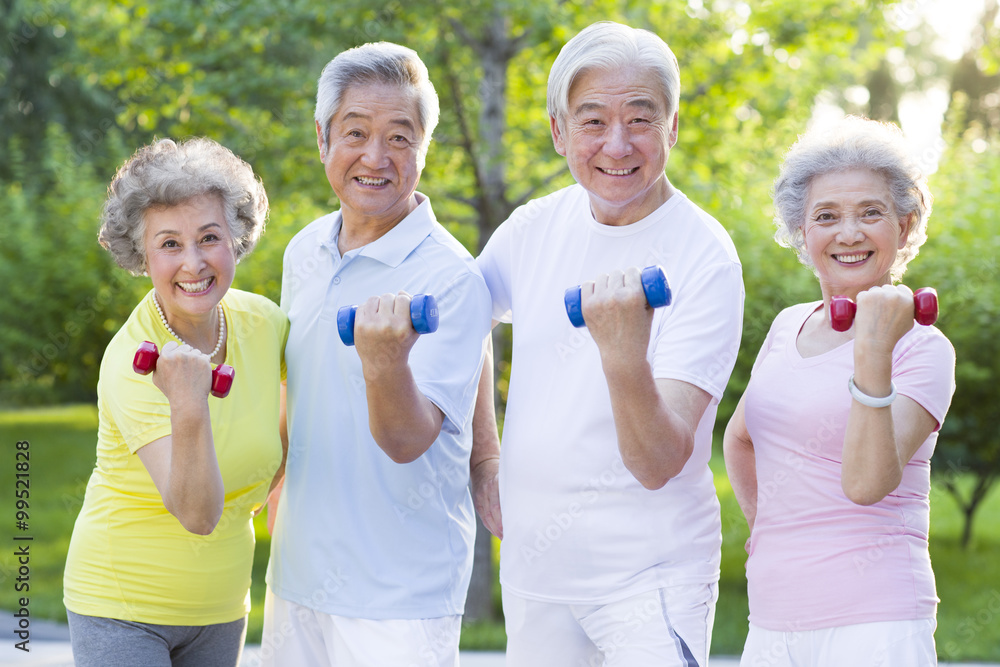 Seniors exercising with dumbbells