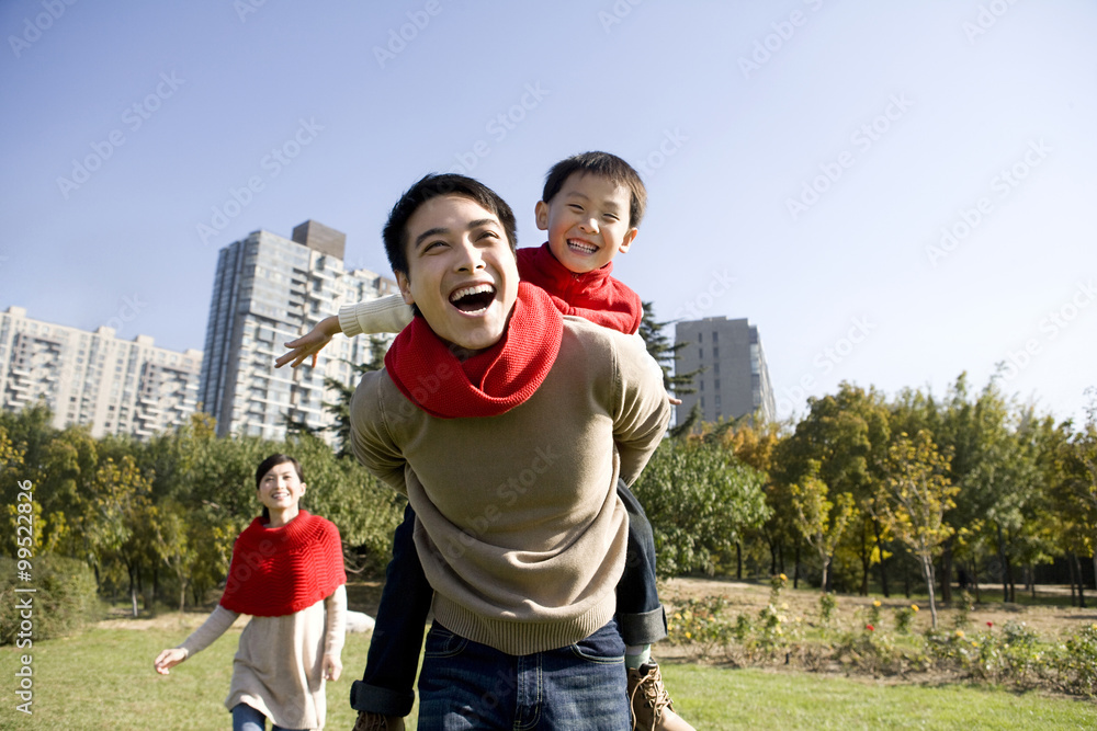 Young Family Enjoying a Park in Autumn