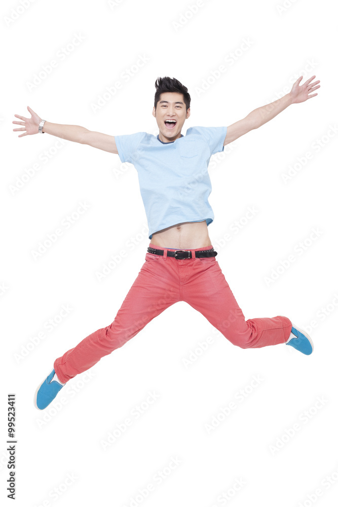 Happy young man jumping