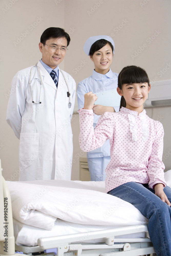 Portrait of a young and healthy girl and her doctor and nurse