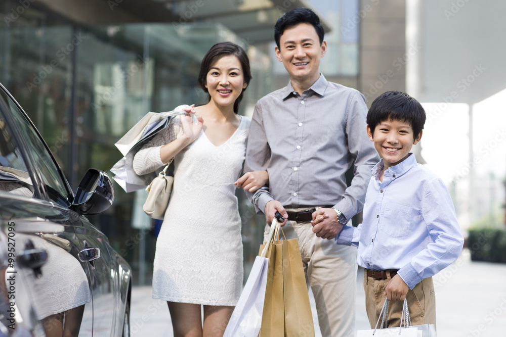 Happy family with shopping bags