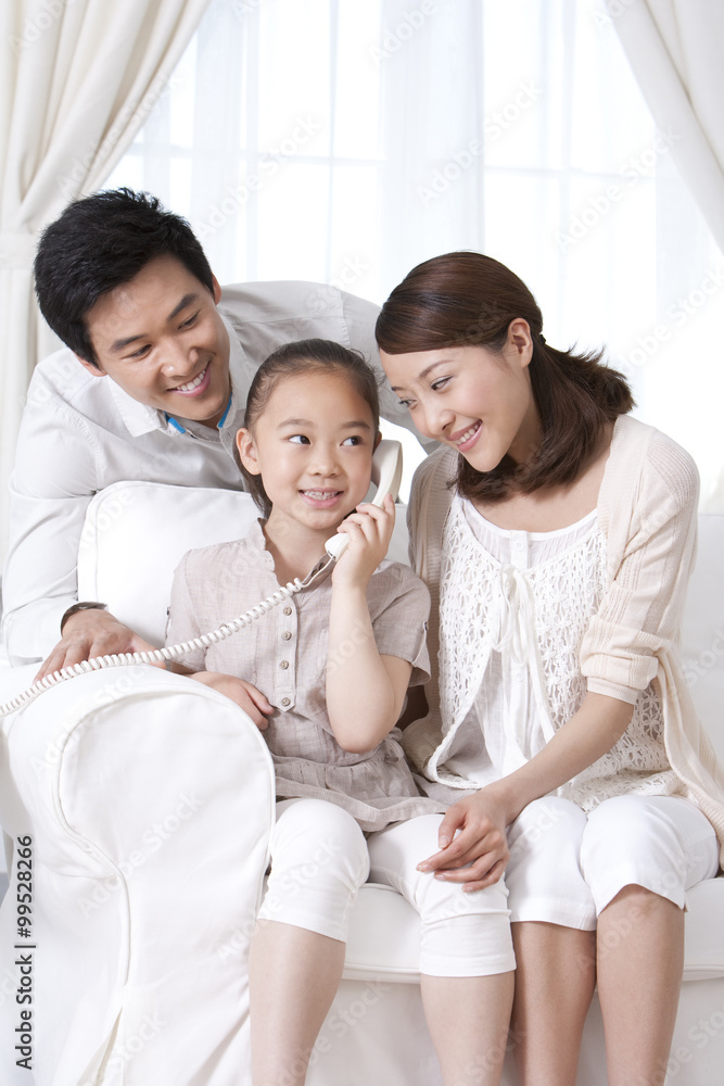 Happy family on the phone 