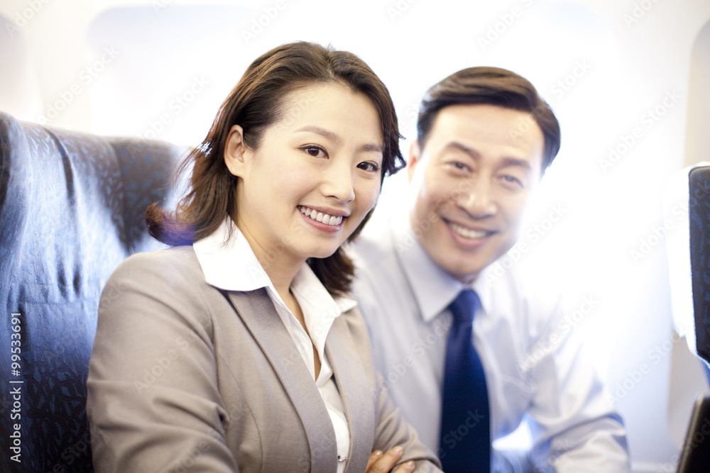 Businesspeople on a plane