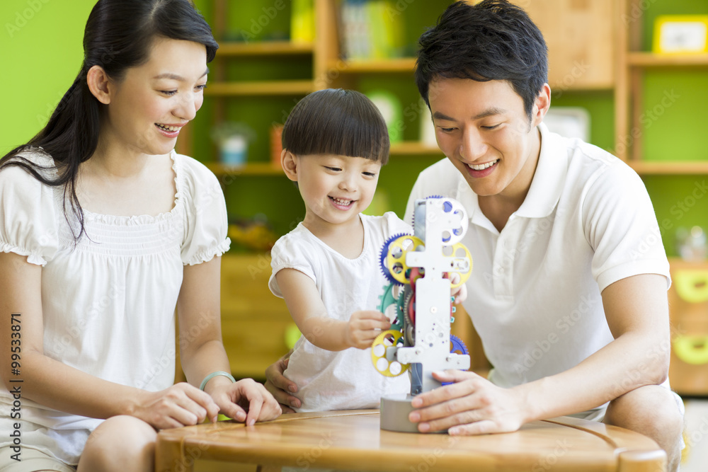 Young family playing toy