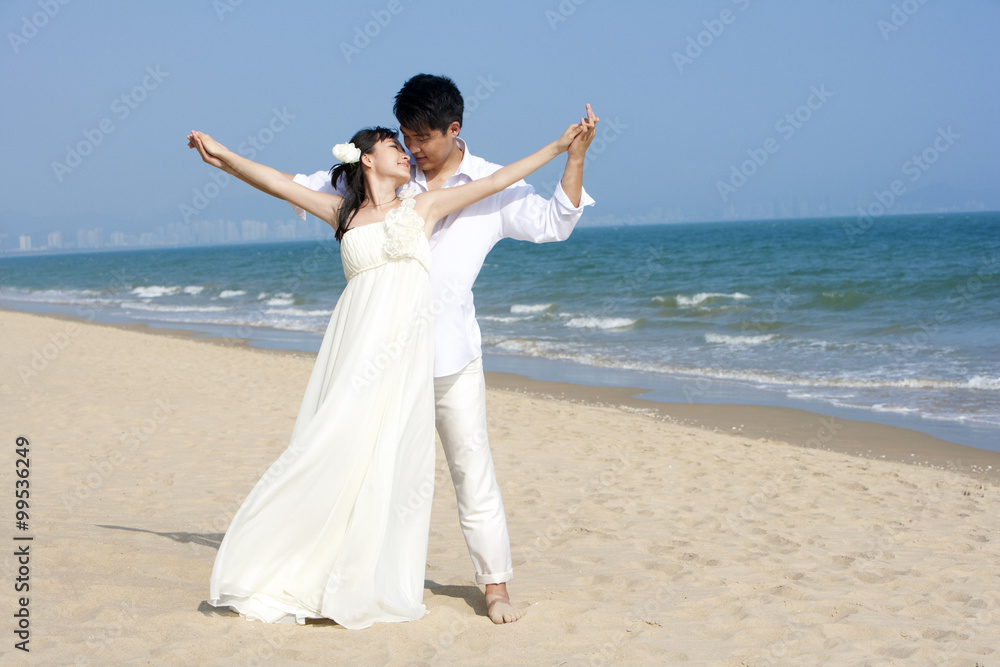 Happy newlyweds on the beach