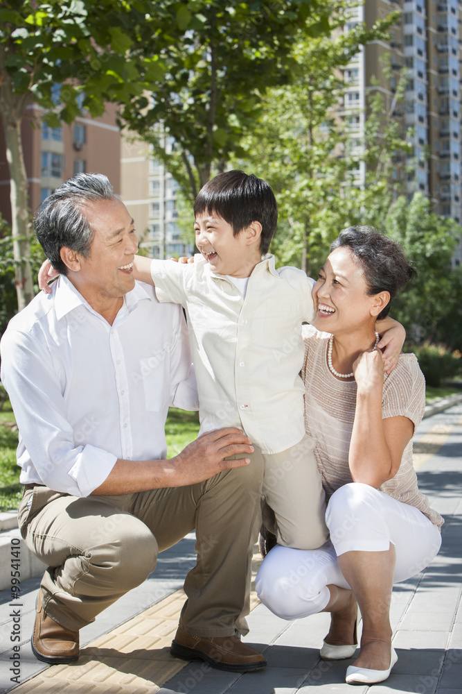 Amused grandparents and grandson