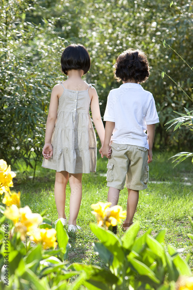 Cute children having fun in garden