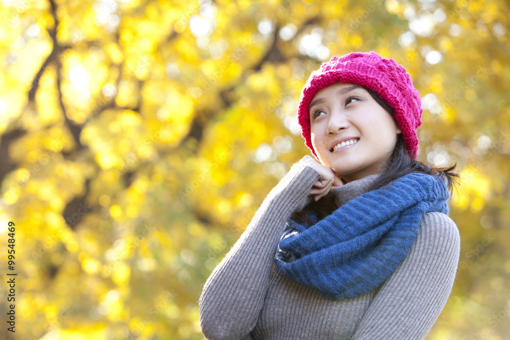 Young Woman in a Park in Autumn