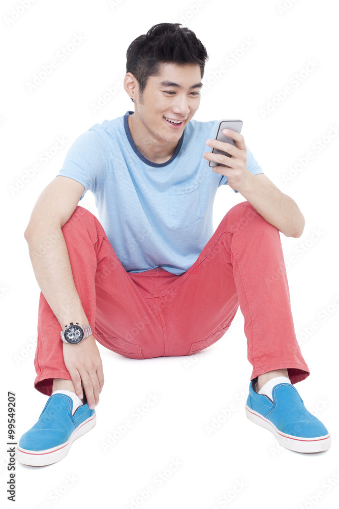 Happy young man and a mobile phone