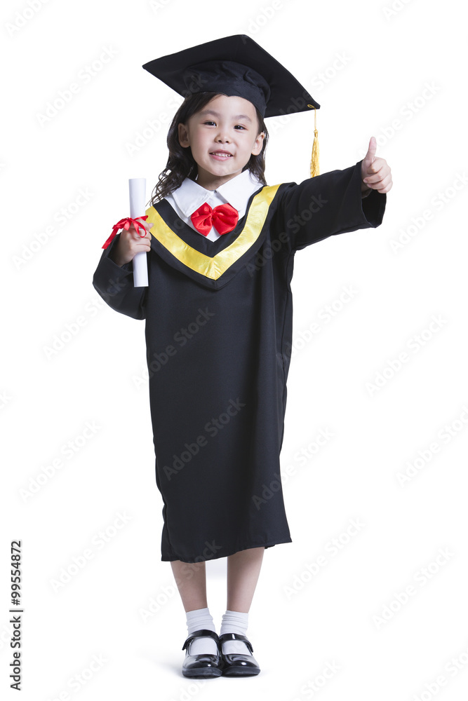 Cute girl in graduation gown doing thumbs up