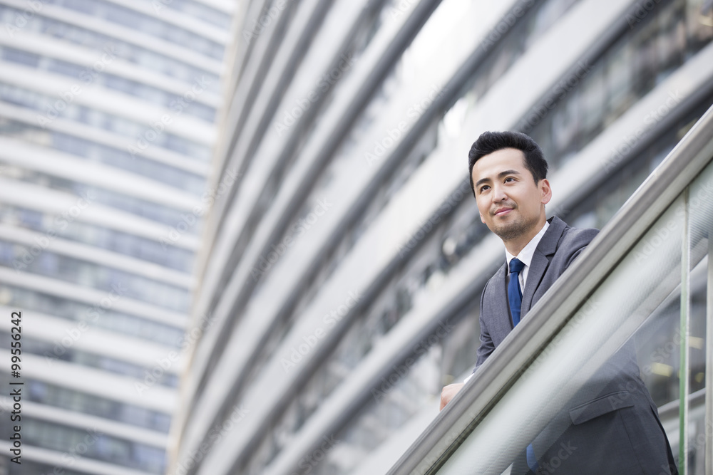 Businessman looking at view thinking