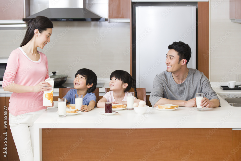 Happy family having breakfast