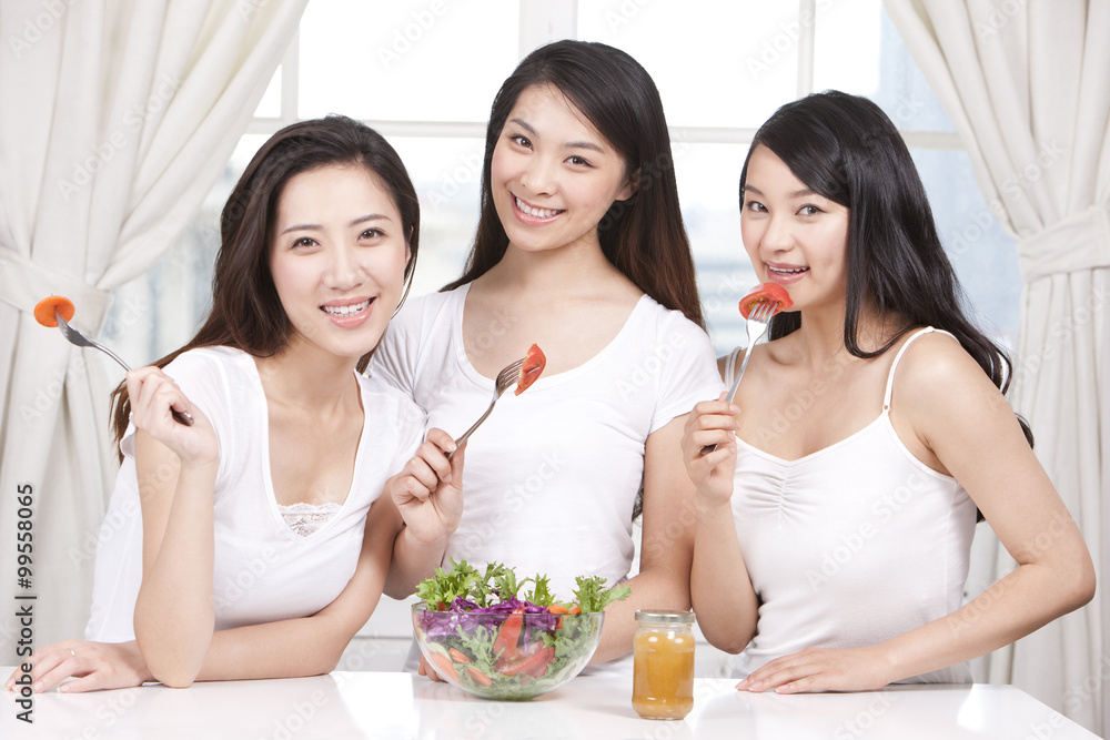 Best female friends sharing salad together