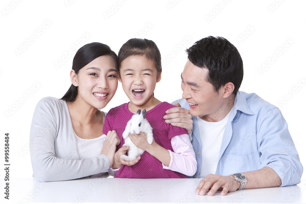 Family playing with rabbit