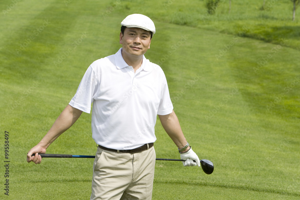 Portrait of a male golfer on the course