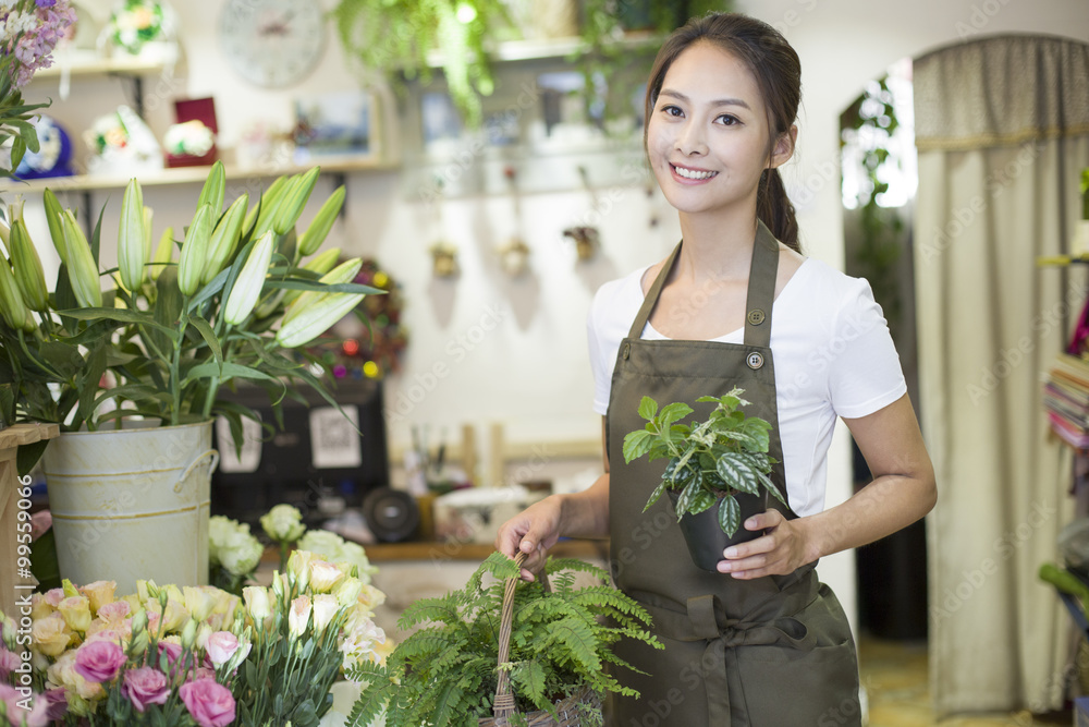 Female florist working in shop