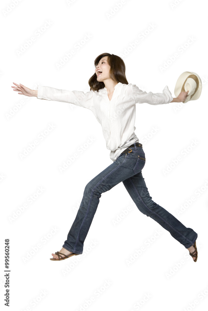 Portrait of Young Woman Jumping