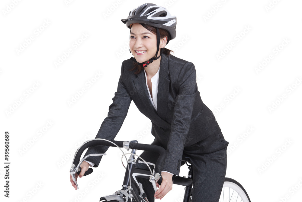 Young businesswoman on a bike