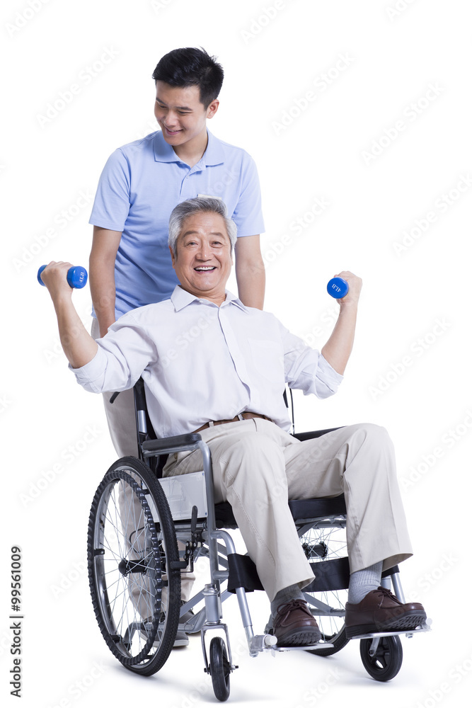 Male nursing worker helping senior man doing exercise