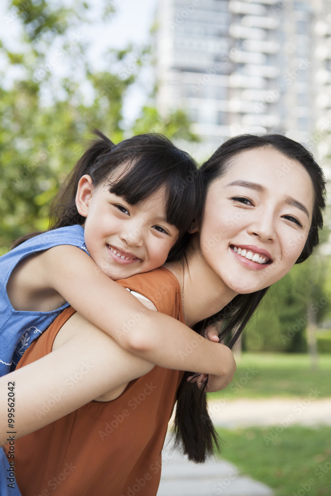 Portrait of happy mother and daughter