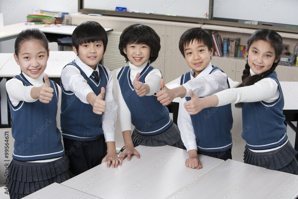 Five excited students in the classroom