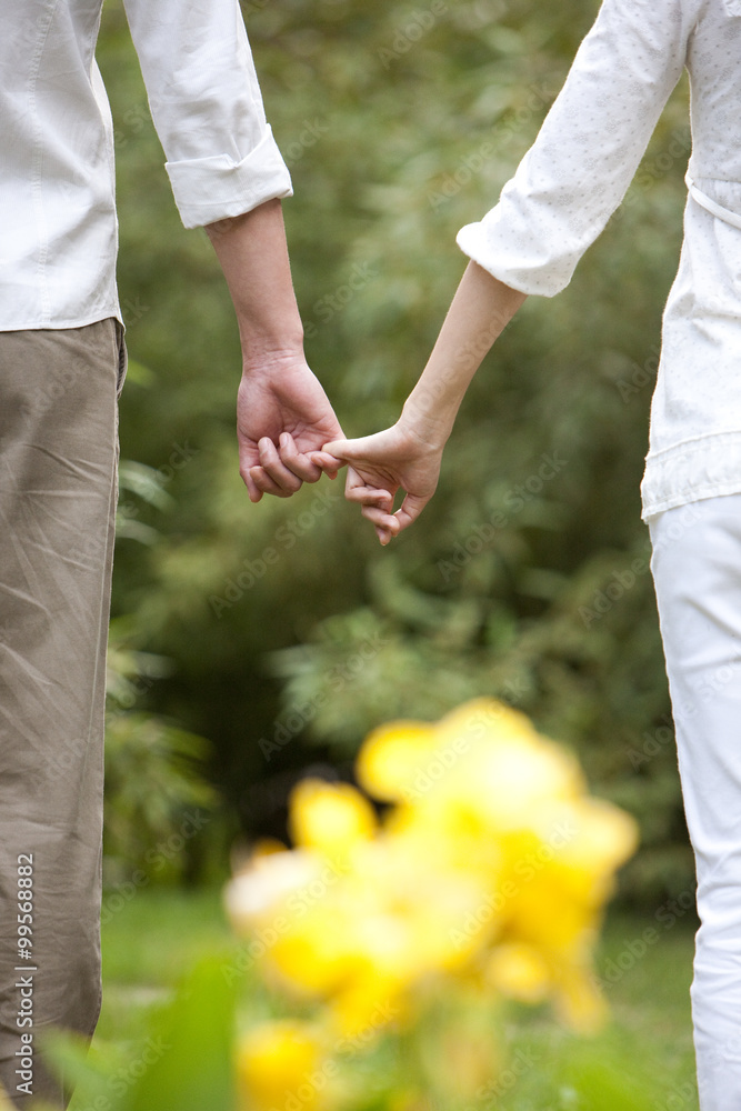 Young couple hand in hand