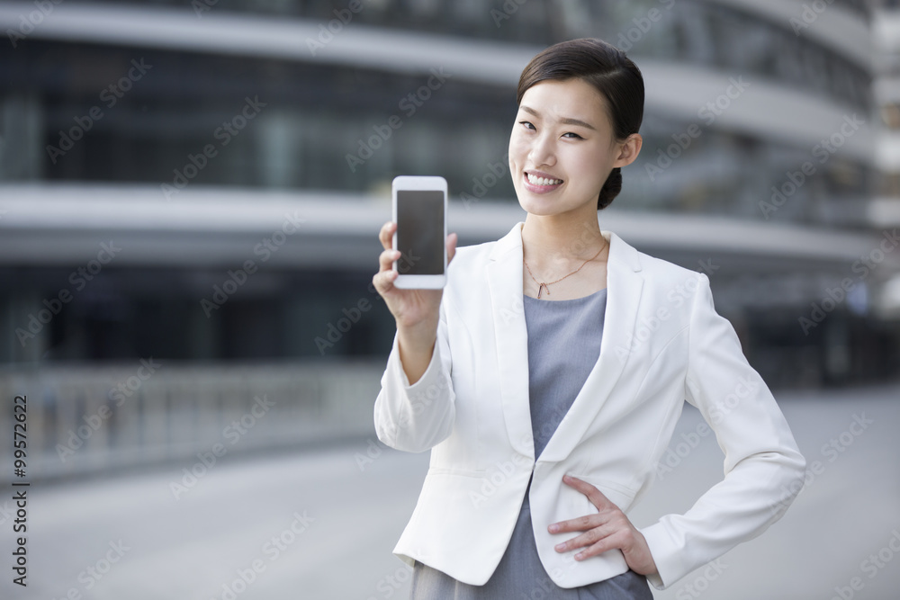 Businesswoman showing smart phone