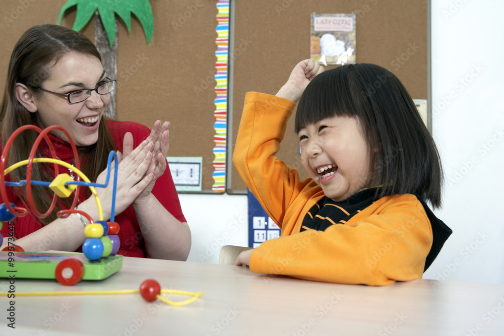 Teacher And Student Smiling, Clapping