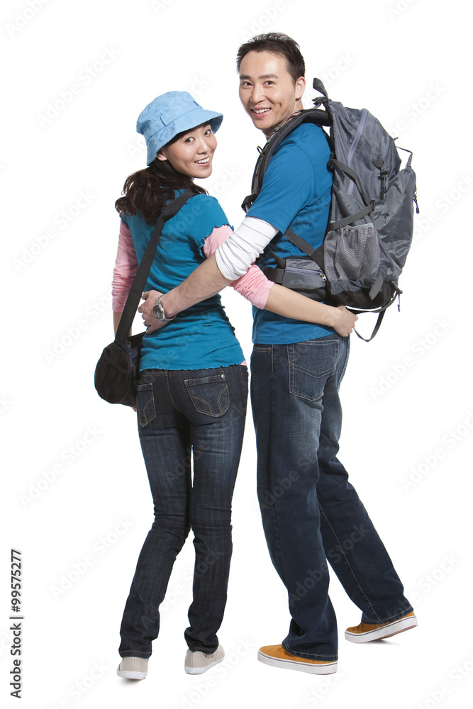 Portrait of young couple travelling