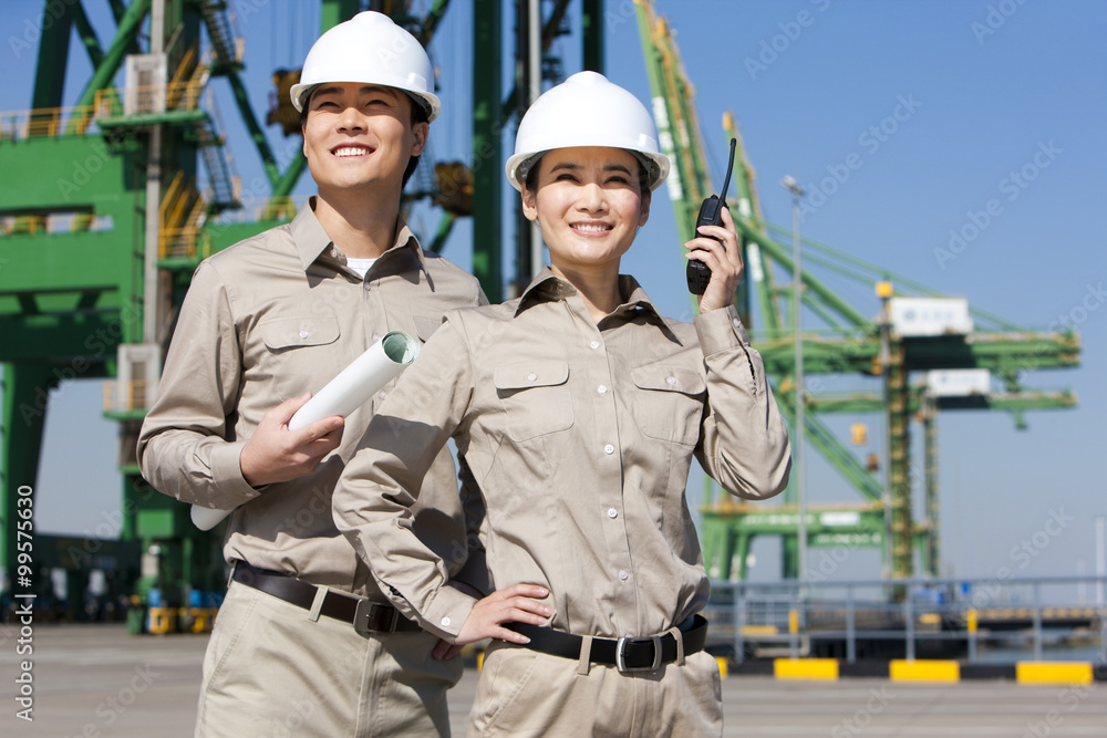 shipping industry workers looking in the distance