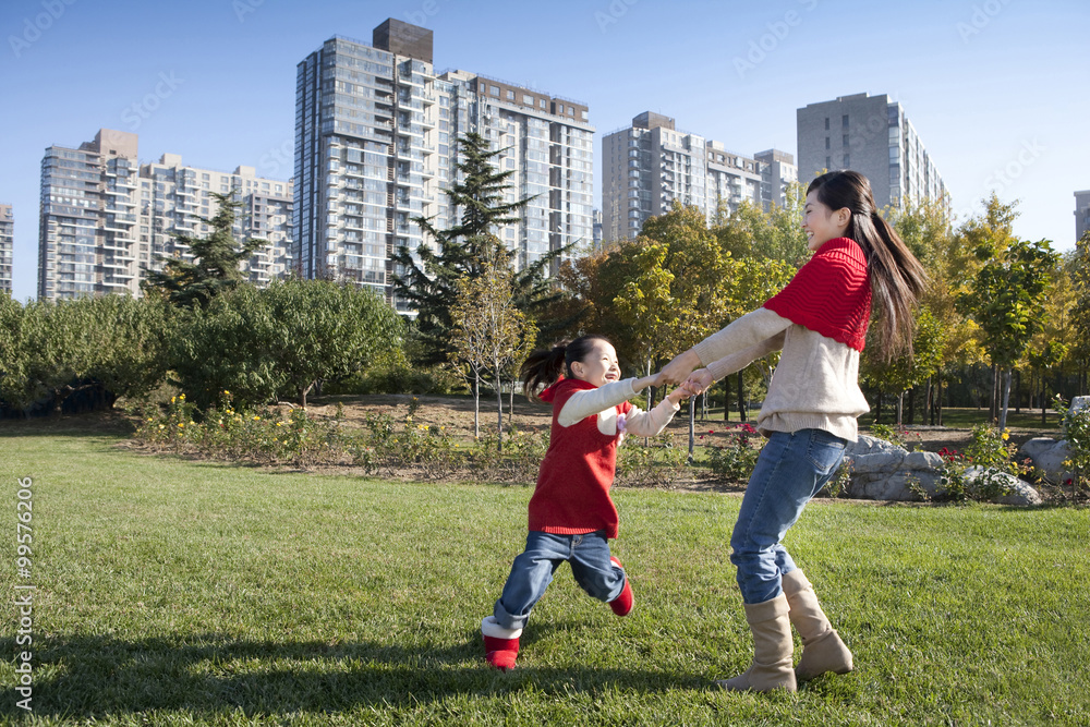 Mother and Daughter Playing in a Park