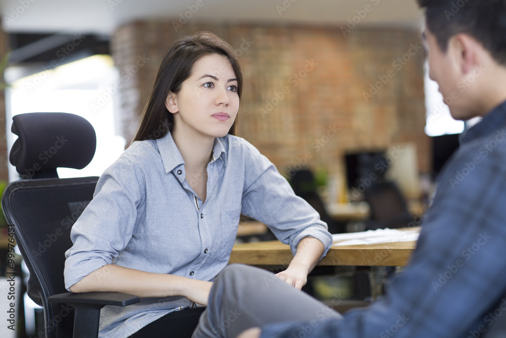 IT workers talking in office