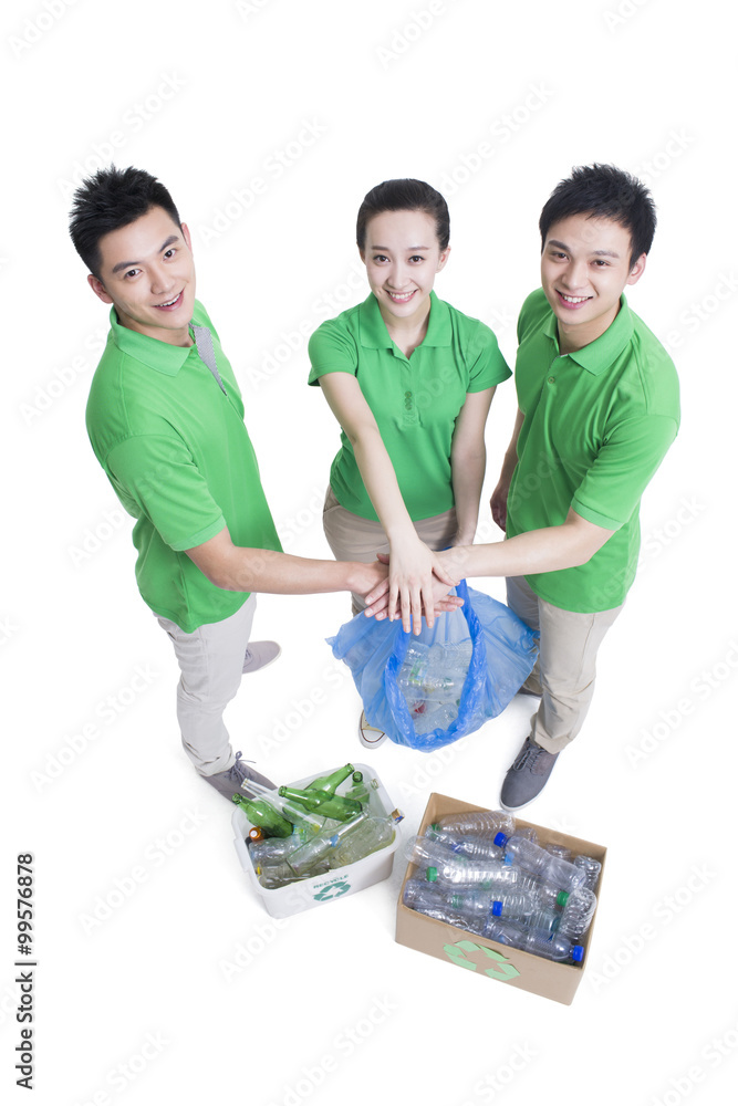 Happy volunteers recycling