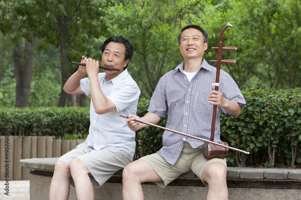 Old men playing Chinese traditional instrument in park