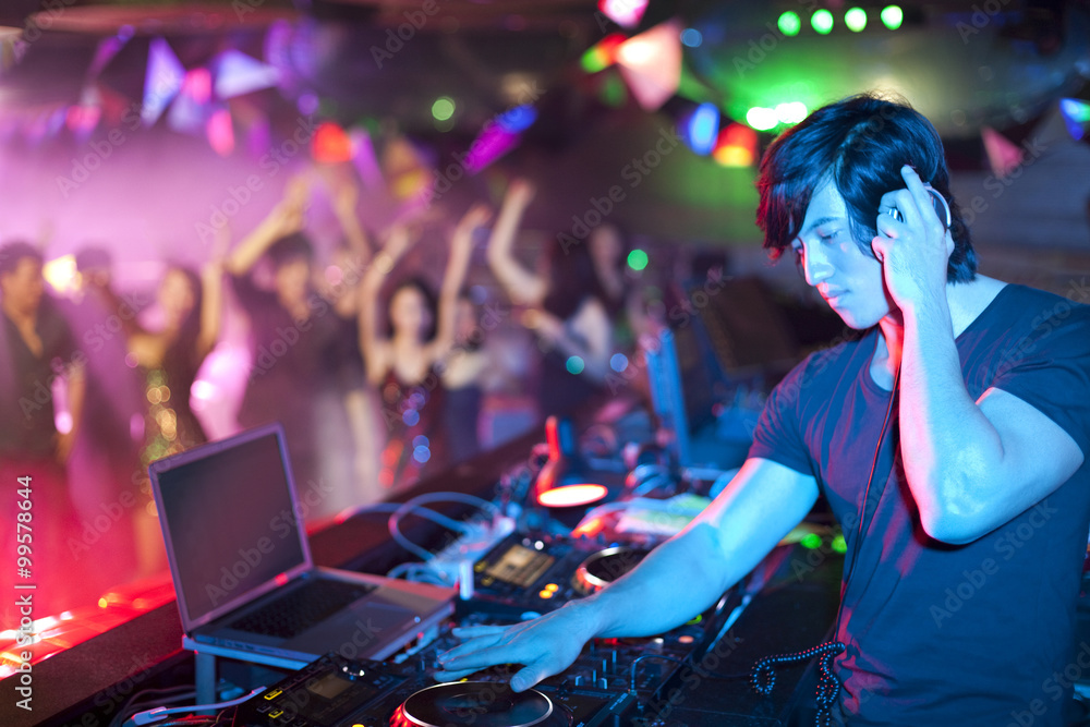 DJ doing record Scratching in nightclub