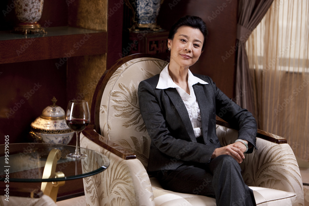 Mature businesswoman in a luxurious room