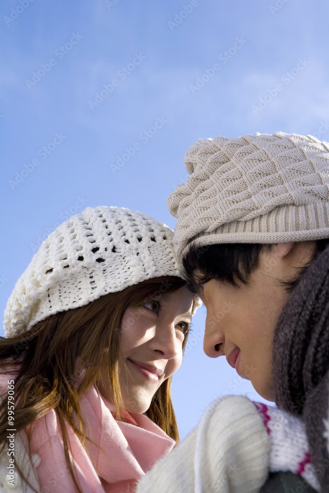 Young couple face to face with each other