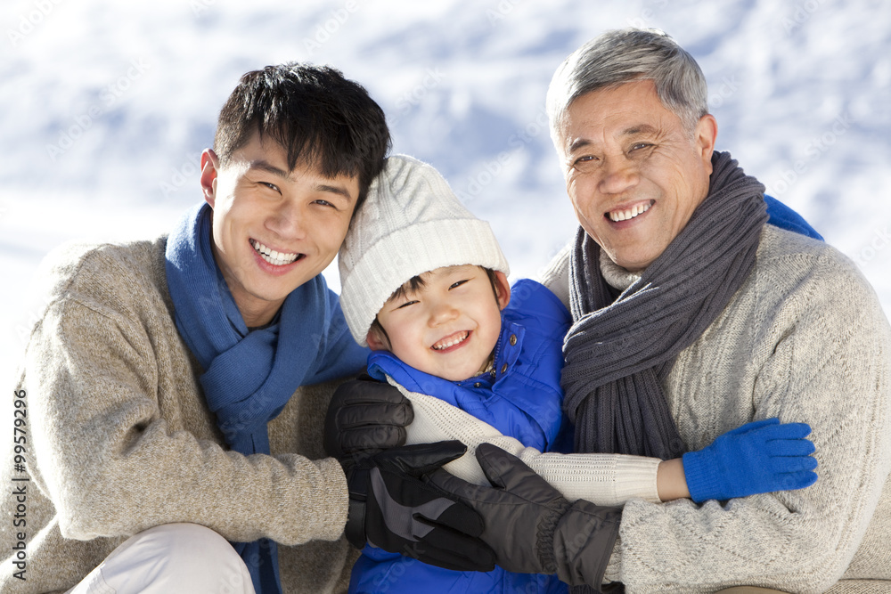 Three generation family having fun in snow